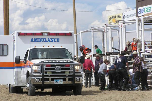 EMTs help Dyson Smith. Photo by Dawn Ballou, Pinedale Online.