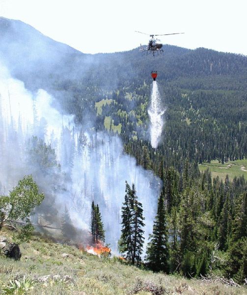 Helicopter water drop. Photo by U.S. Forest Service.