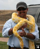 Holding the Snake. Photo by Dawn Ballou, Pinedale Online.