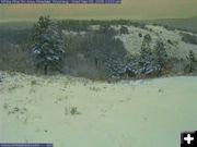 Snow in the mountains. Photo by White Pine Ski Area webcam.