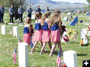 Placing flowers. Photo by Dawn Ballou, Pinedale Online.