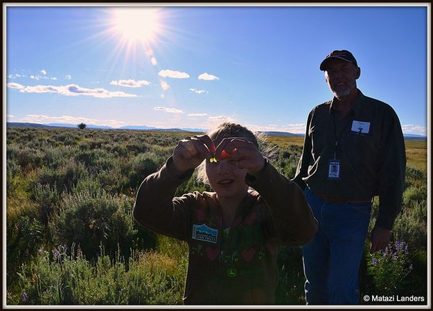 Mesa Examining a Seed Pod. Photo by Matazi Landers.