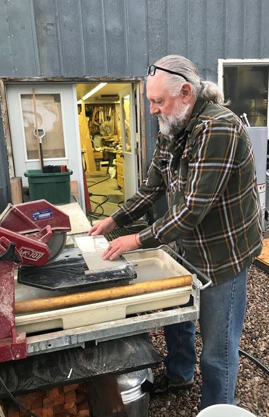 Cutting backing boards. Photo by .