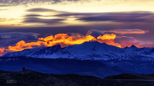 Fire Behind The Peaks. Photo by Dave Bell.