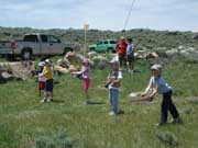 Kids practicing fly casting during Kids Fishing Day at the CCC Ponds. Pinedale Online photo.